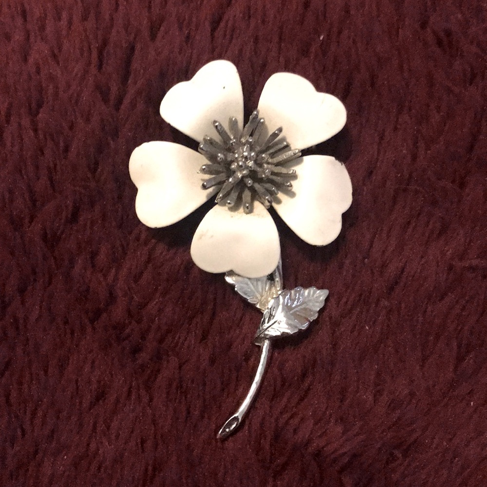 Bundle 3/$30 with other various itemsLike this  flower brooch